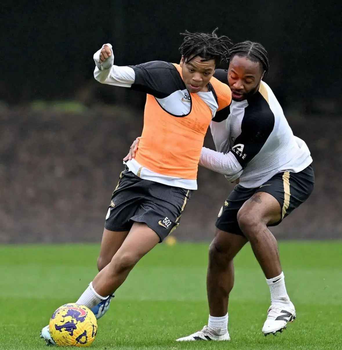 Two J-Stars players competing for the ball in training